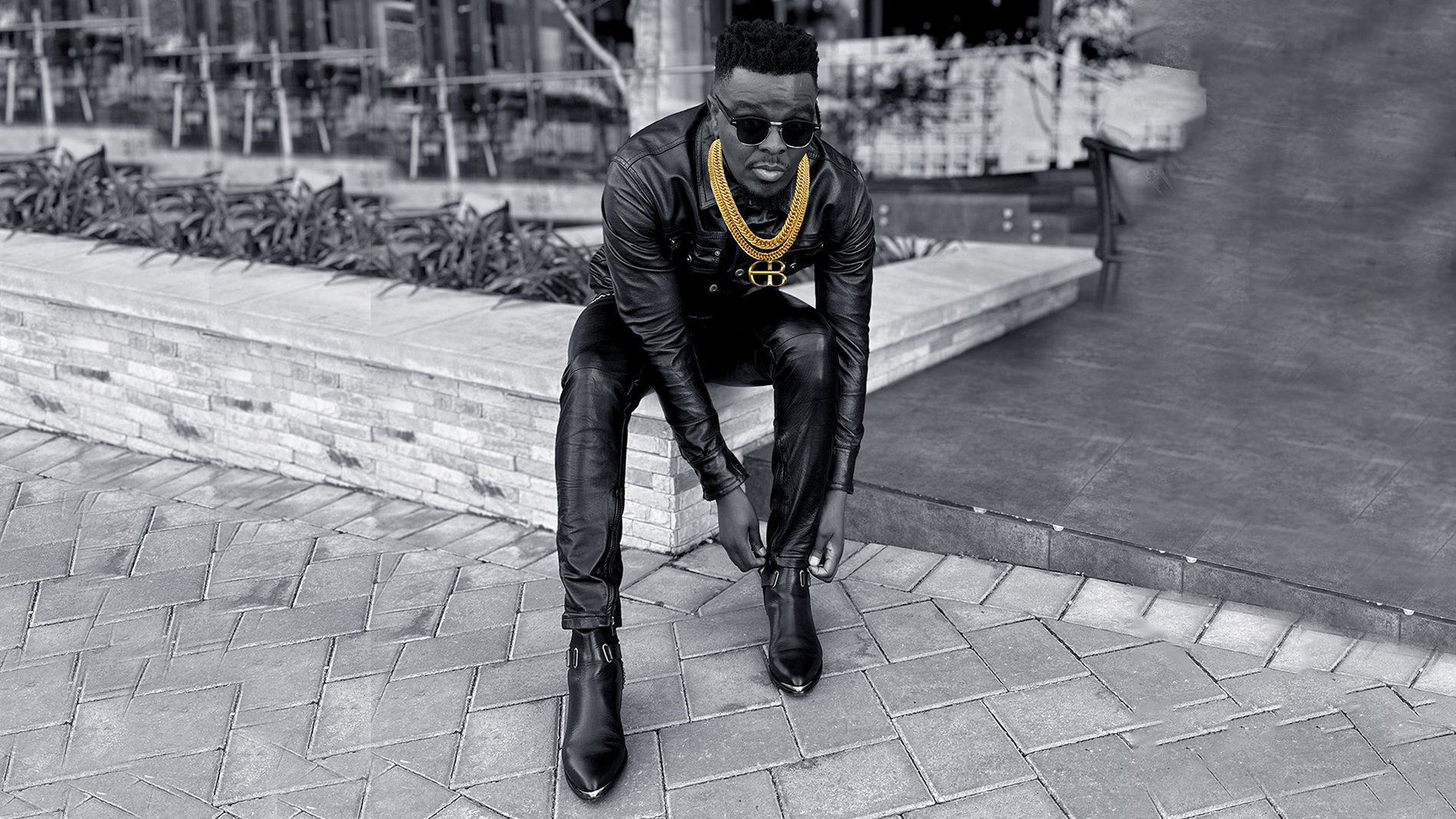 DOPEBOYS founder in full leather look with signature gold DB chain, Johannesburg