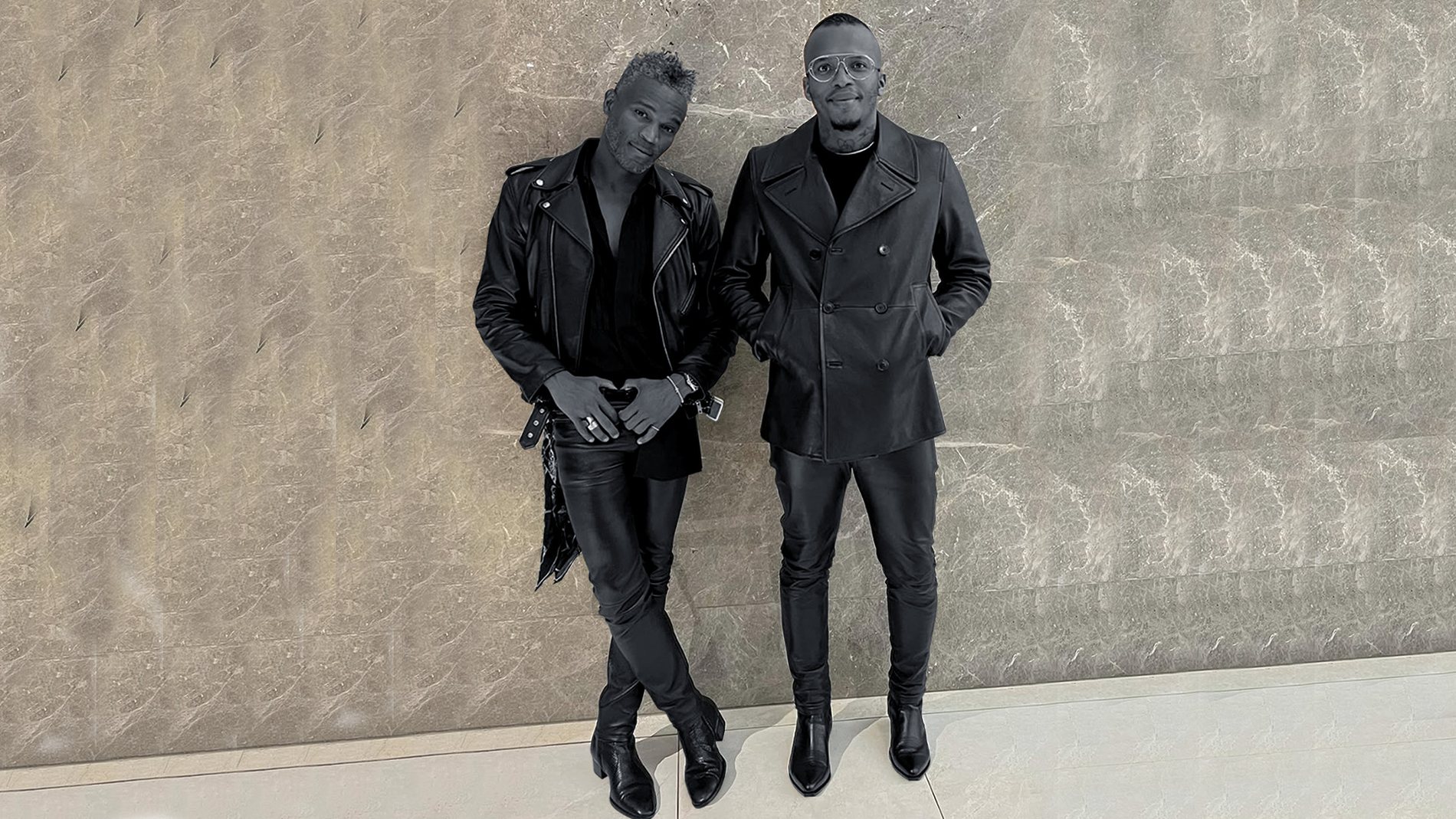 DOPEBOYS duo in full leather looks against a marble wall, Johannesburg