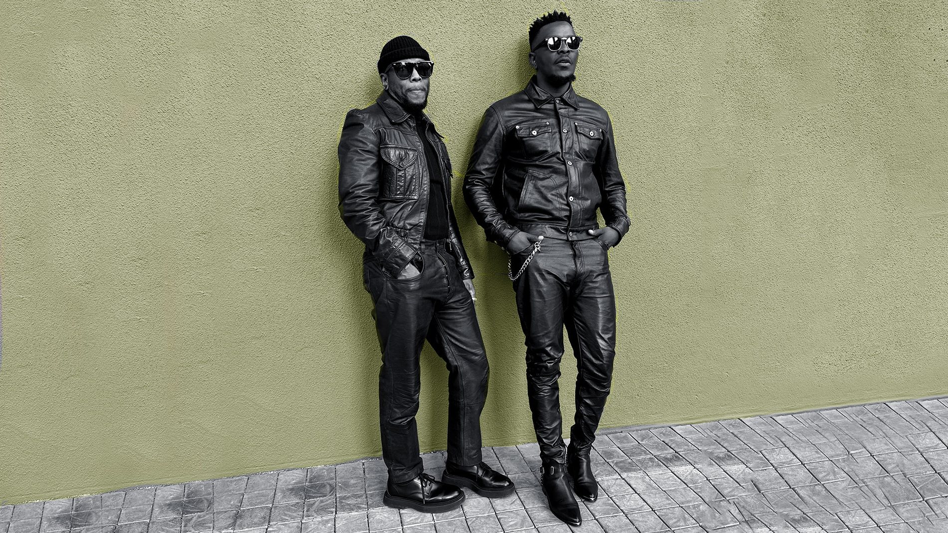 DOPEBOYS duo in full leather looks against an olive wall, Johannesburg